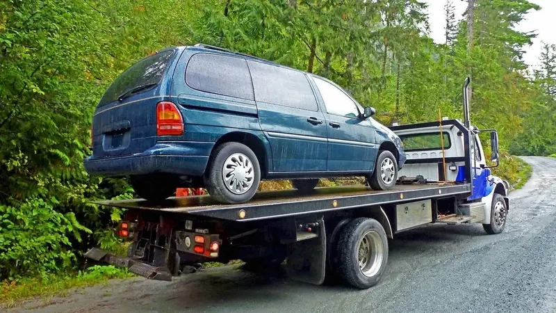 Victoria flatbed towing a cargo van