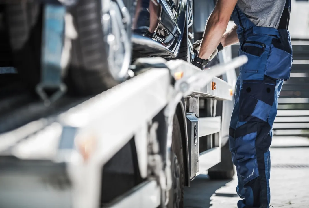 Victoria tow truck driver loading a car onto a flatbed